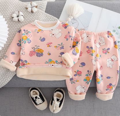 Unisex thermal pajama set, featuring cartoon designs on cozy fleece for kids' winter wear