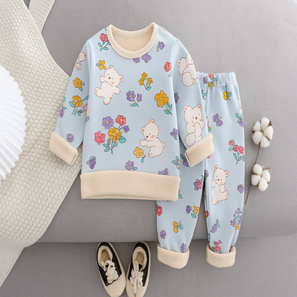 Toddler fleece thermal pajamas with vibrant cartoon patterns, ideal for comfortable lounge