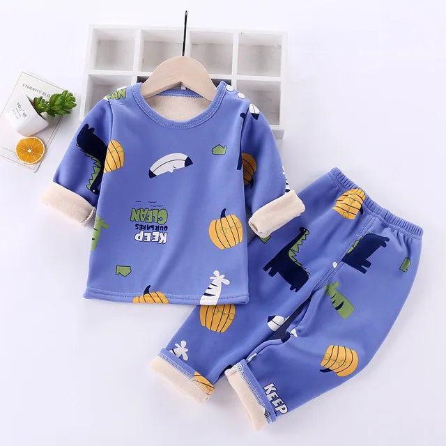Cartoon fleece thermal pajamas for unisex kids, a cozy essential for chilly winter evenings