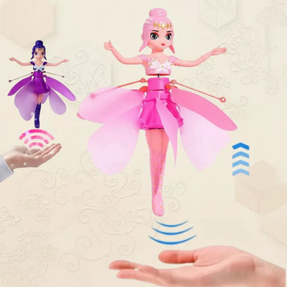 Children playing with a gesture-controlled flying fairy doll outdoors, enjoying interactive fun