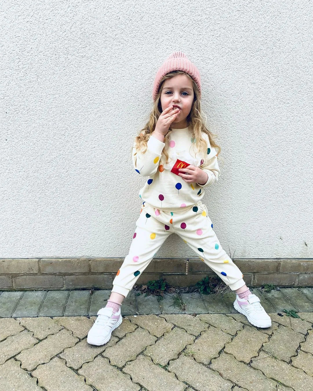 Close-up of the waistband on unisex cotton pants from a kids hooded set, comfortable fit