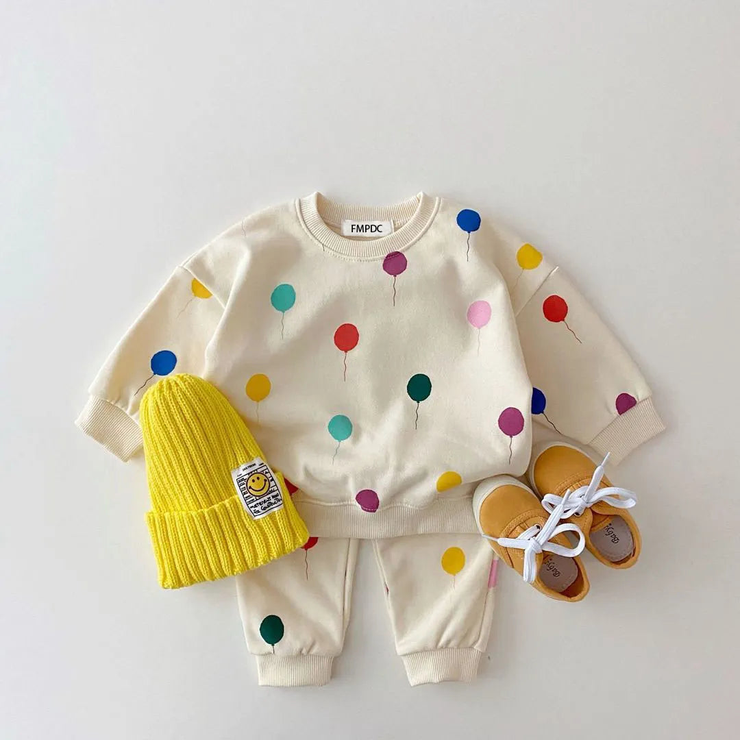 Set of comfortable cotton childrens apparel: hooded sweater and pull-on pants