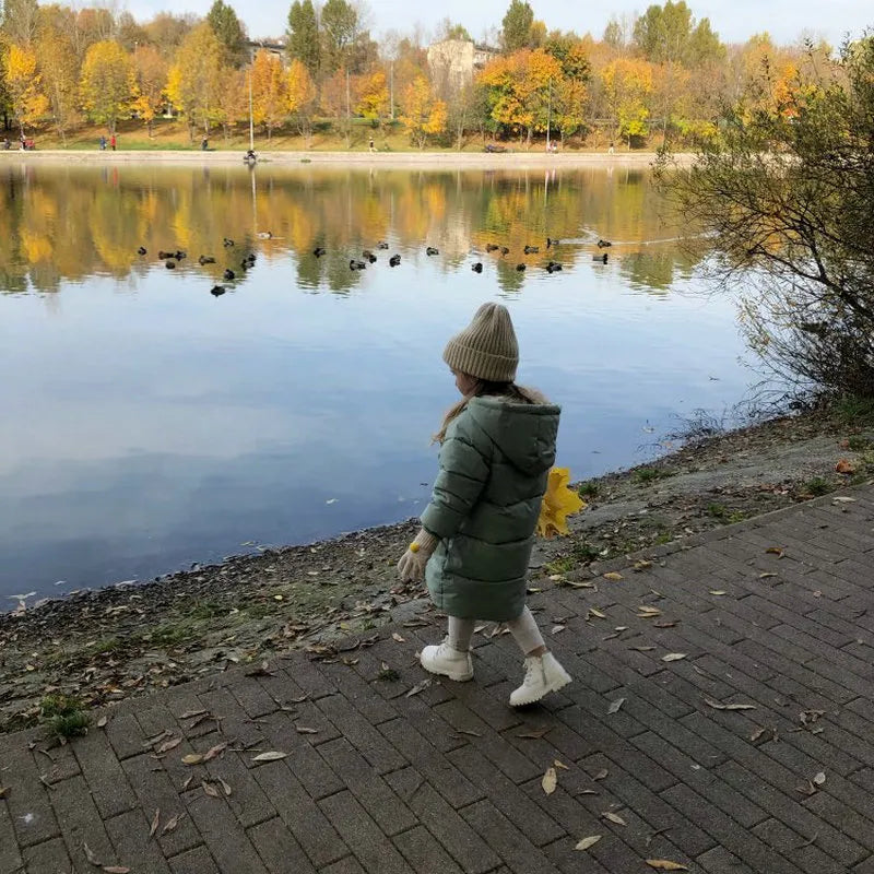 Unisex children's long padded winter coat, hooded, with two deep front pockets.