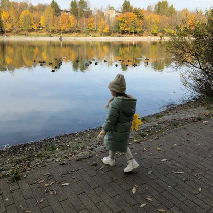 Unisex children's long padded winter coat, hooded, with two deep front pockets.