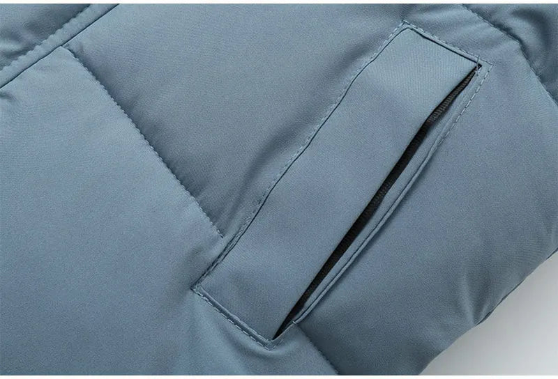 Detailed stitching on a unisex kids' long padded winter jacket, indicating quality.