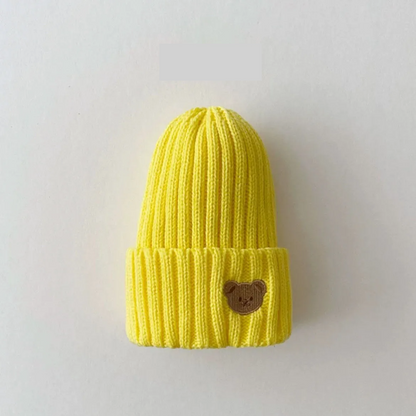 Stylish unisex toddler beanie, hand-knitted with a cute bear embroidery, essential for chilly days.