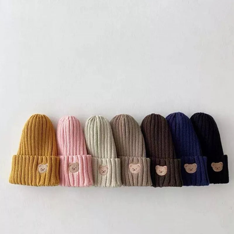 Warm knitted baby hat, featuring a charming bear embroidery, perfect accessory for baby fashion.