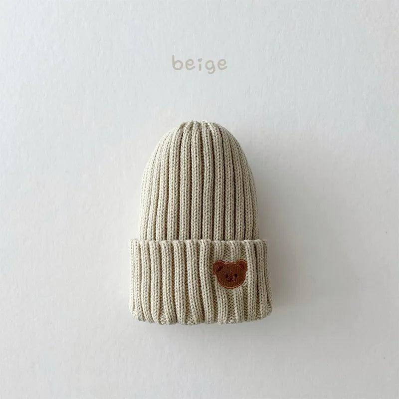 Comfortable cotton knitted beanie hat for babies and toddlers, with an adorable bear face embroidery.