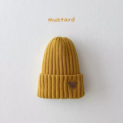 Knitted infant beanie hat with a fun bear embroidery, designed for unisex wear and maximum warmth.