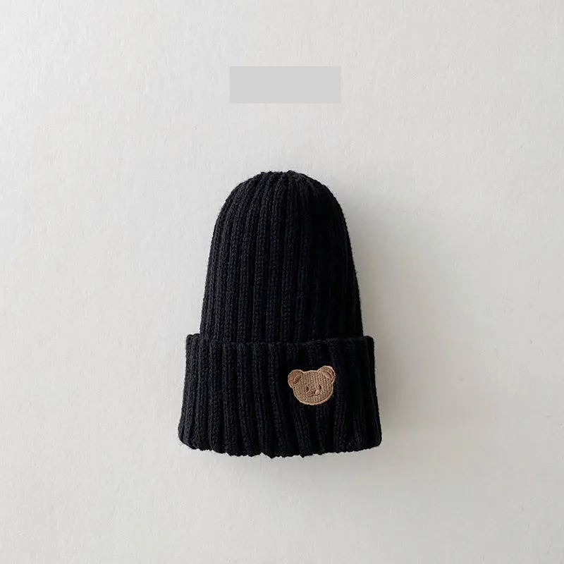 High-quality cotton knitted beanie hat with bear embroidery, designed for toddlers, soft and snug fit.