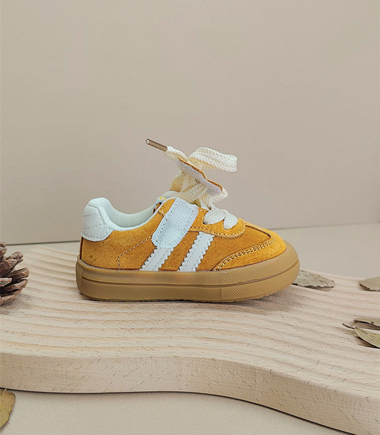 Pair of pink unisex baby sneakers with laces, designed for comfort and playground fun.