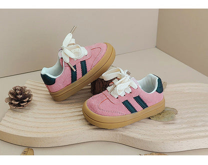 Front view of unisex baby sneakers with laces, ideal for developing little feet.