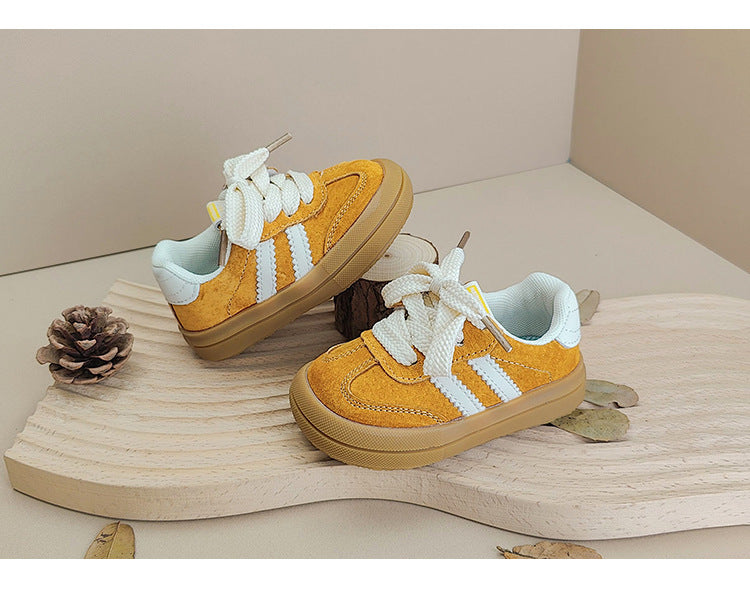 Side profile of anti-slip unisex toddler sneakers, offering support and stability.