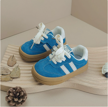 Collection of unisex baby laced sneakers in various colors, durable and comfortable for kids.