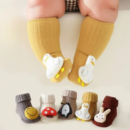 Unisex kids non-slip cotton socks in blue with a playful cartoon character, perfect for safe play and first steps.