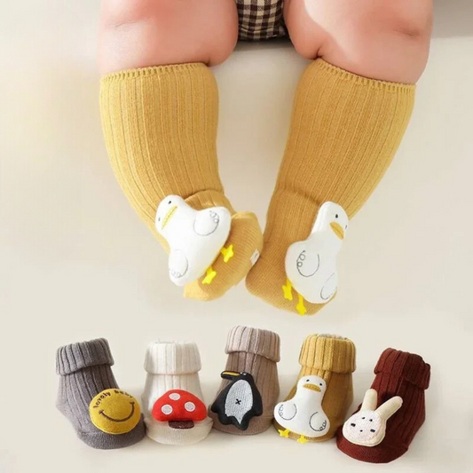 Unisex kids non-slip cotton socks in blue with a playful cartoon character, perfect for safe play and first steps.