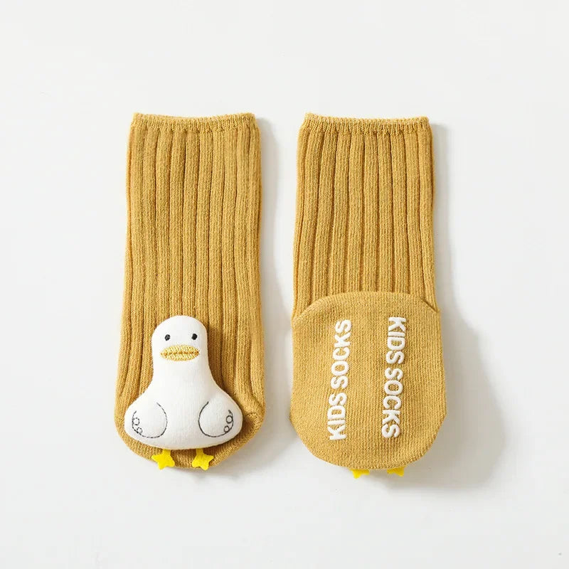 Green non-slip infant apparel socks made of cotton, designed with anti-skid grips for active toddlers.