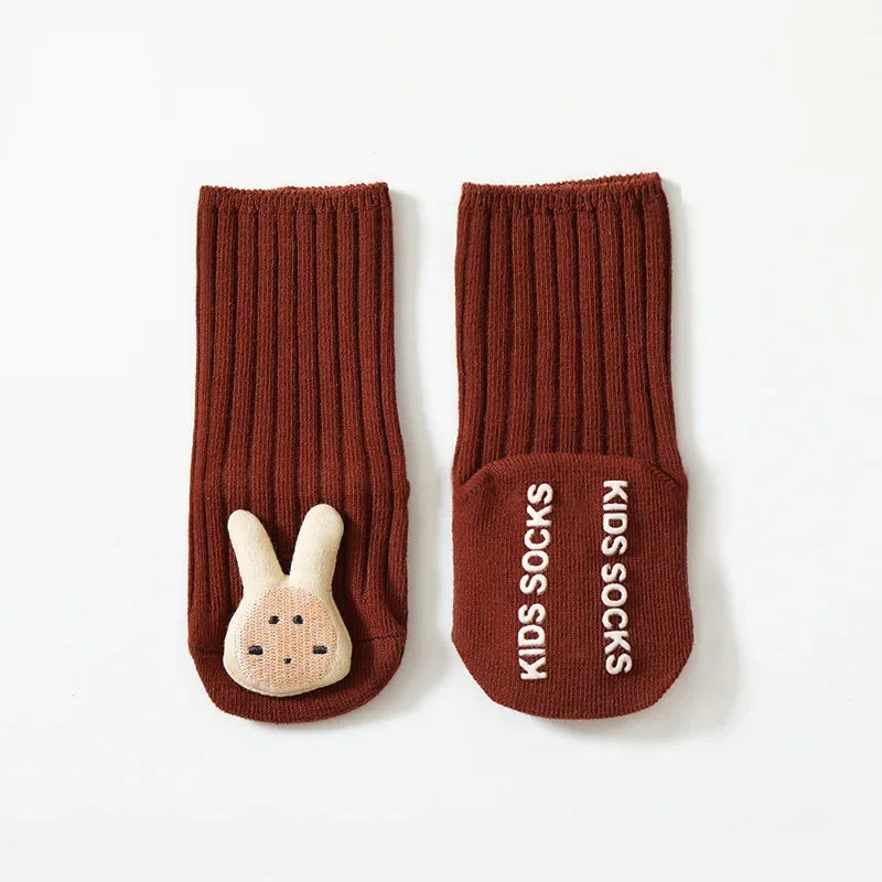 Unisex baby cotton socks, grey with white non-slip grips, ideal for toddlers learning to walk and safe play.