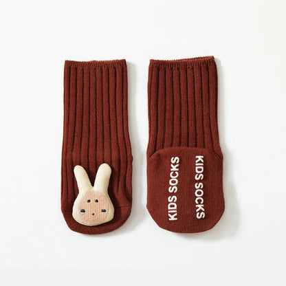 Unisex baby cotton socks, grey with white non-slip grips, ideal for toddlers learning to walk and safe play.