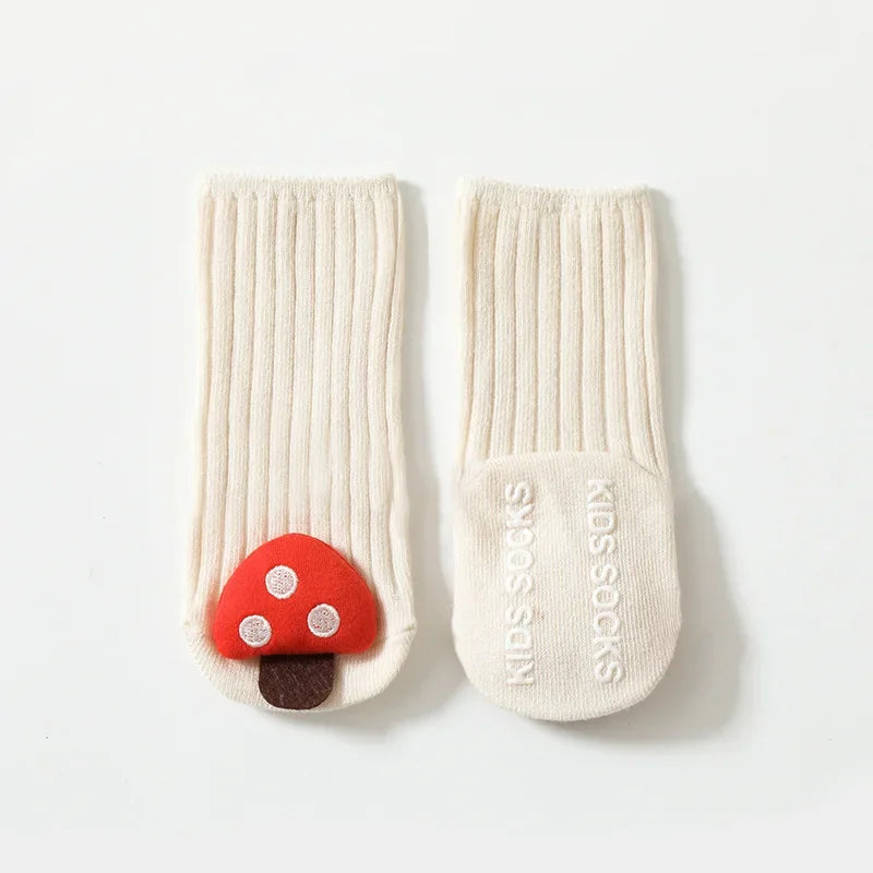 Orange non-slip toddler socks with durable anti-skid dots, made from breathable cotton for comfortable safe play.
