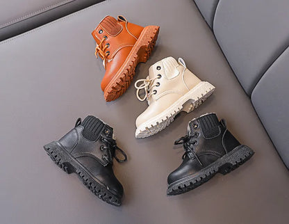Front view of kids snow boots, waterproof exterior, plush-lined comfort