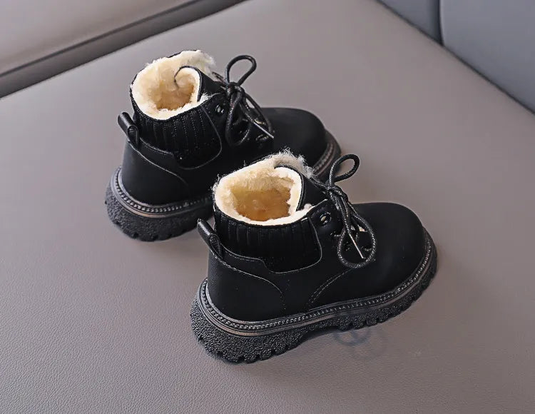 Kids winter anti-skid boots in a pile, assorted colors, plush and warm