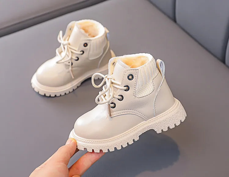 Unisex kids winter snow boots, interior view showing thick plush insulation