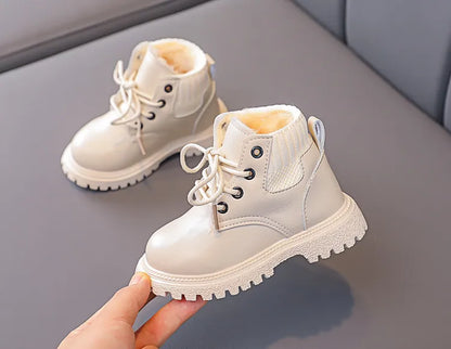 Unisex kids winter snow boots, interior view showing thick plush insulation