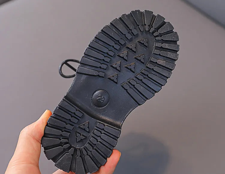 Side profile of kids anti-skid winter boots, plush and waterproof design