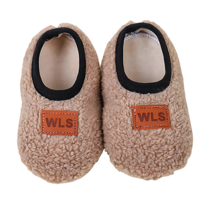 Unisex kids home slippers with a soft sole and plush feel, ideal warm footwear for children
