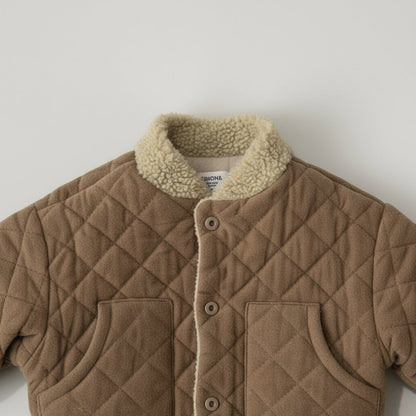 Toddler wearing a unisex quilted checkered jacket, perfect for winter outerwear