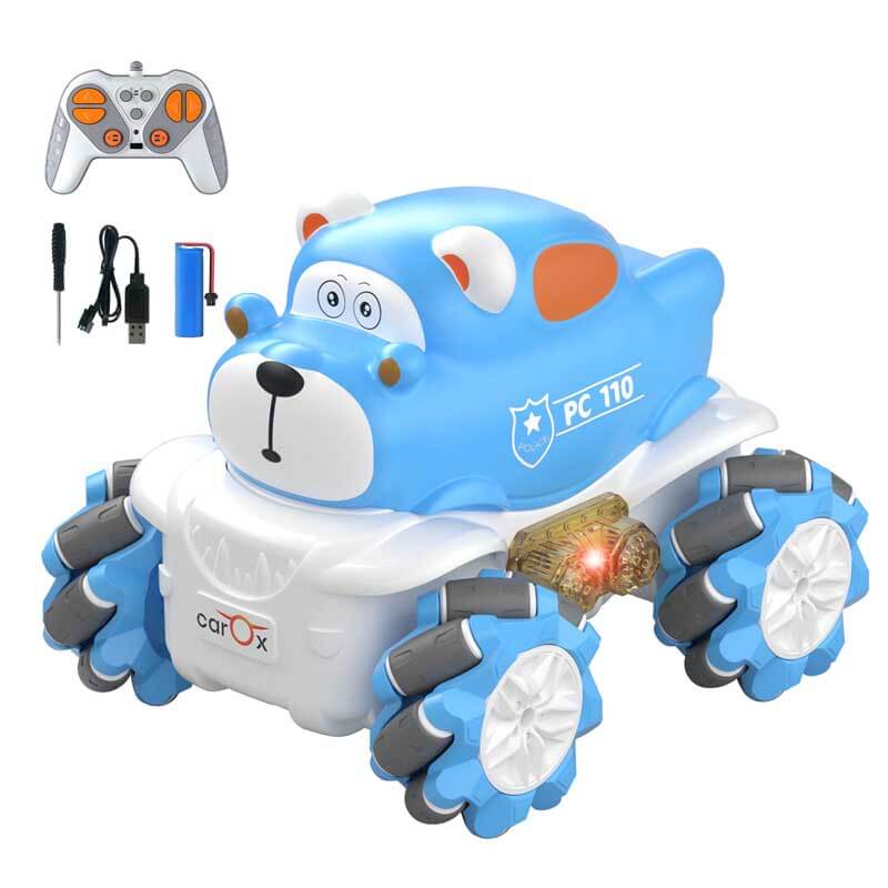 Kids hand holding the remote control next to the LED-lit RC stunt car, ready for exciting playtime maneuvers.