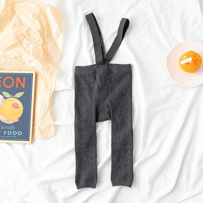 Soft cotton leggings with suspenders in a neutral color, great for everyday children's fashion