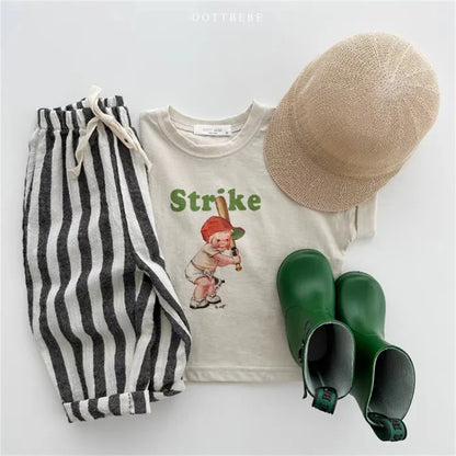 Toddler wearing striped linen cotton trousers, comfortable for casual wear and play