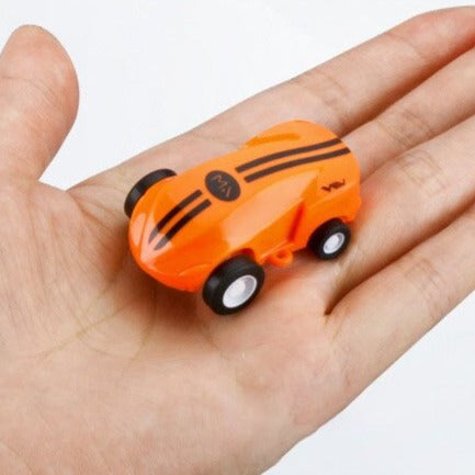 Compact Kids USB rechargeable RC stunt car, red color, showing bright LED lights in action.