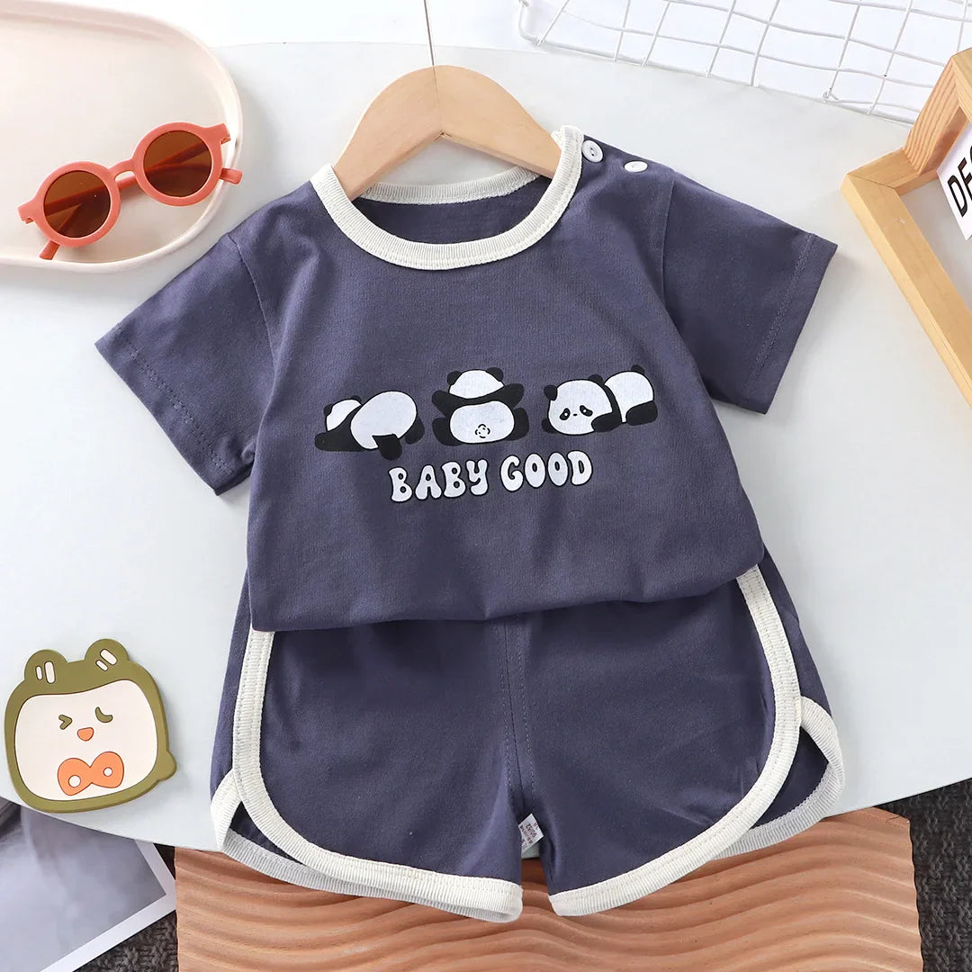 Unisex toddler set featuring a cheerful cartoon graphic on a cotton t-shirt and comfortable shorts, displayed flat