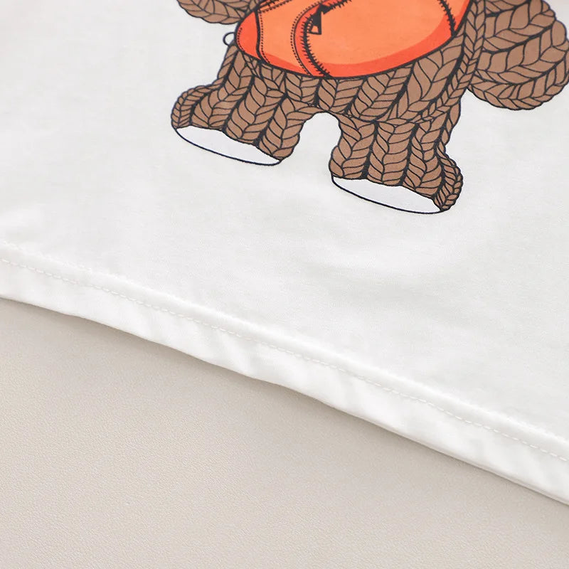 Close-up of bear print on a unisex kids t-shirt, part of a summer sport suit for play clothes