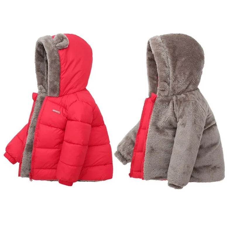 Child reaching for a thicken hooded winter jacket, indicating easy wear for kids
