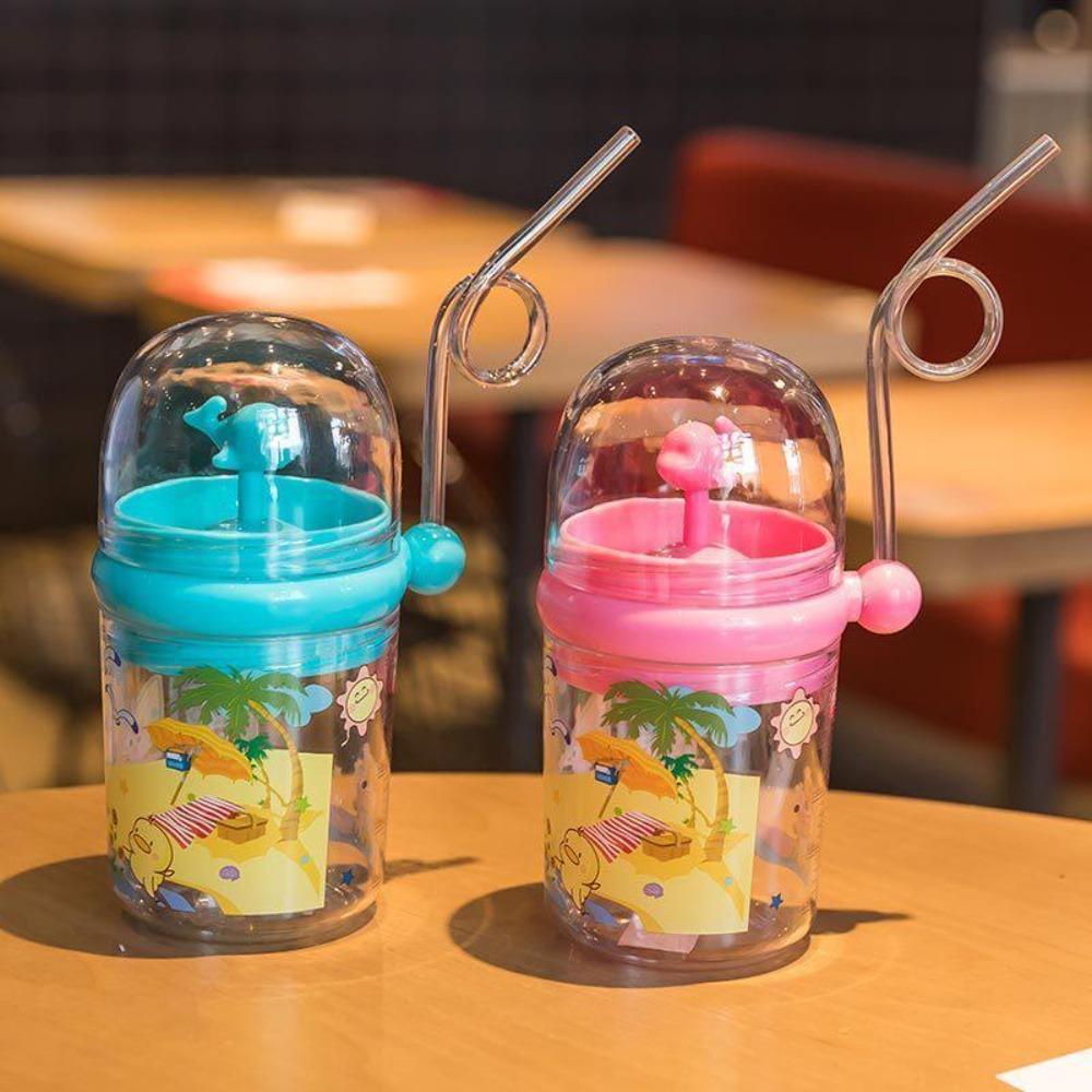 Kids' blue whale water bottle with spray function, ideal for hydration & play, child care essential