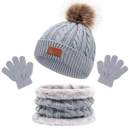 Toddler warm set: a three-piece acrylic knit collection of hat, scarf, and gloves.