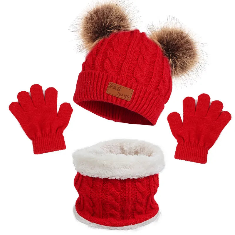 Knitted accessories for kids: a cozy beanie hat, snug scarf, and comfortable gloves set.