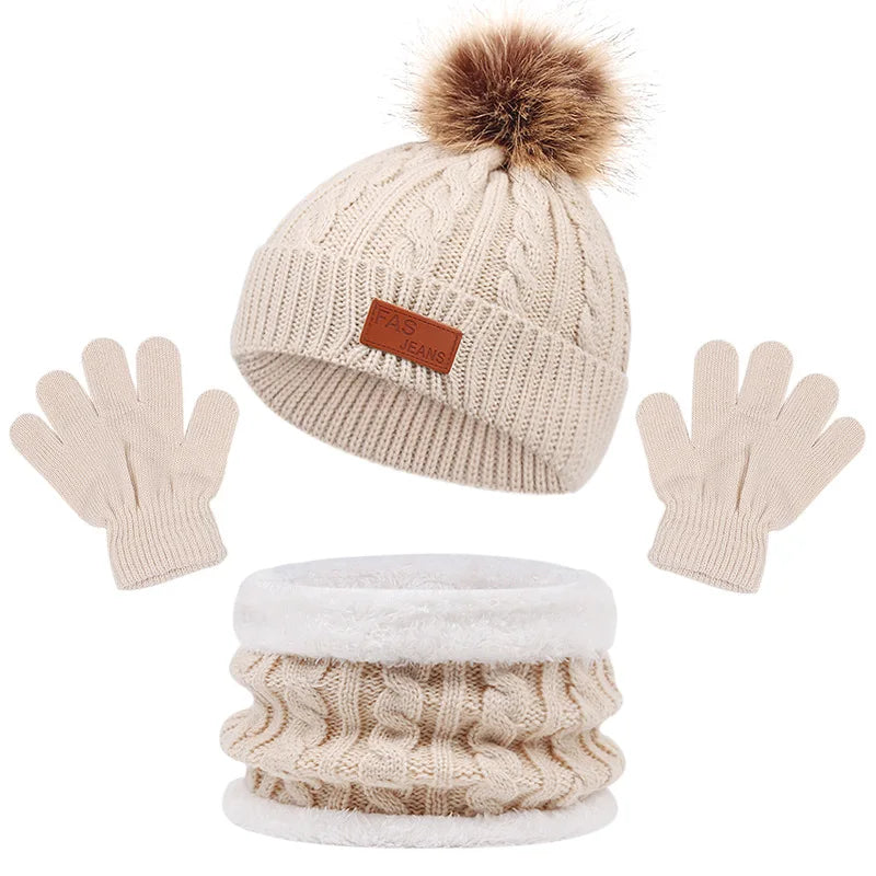 Infant winter wear: a plush acrylic hat, scarf, and gloves in a vibrant solid color.