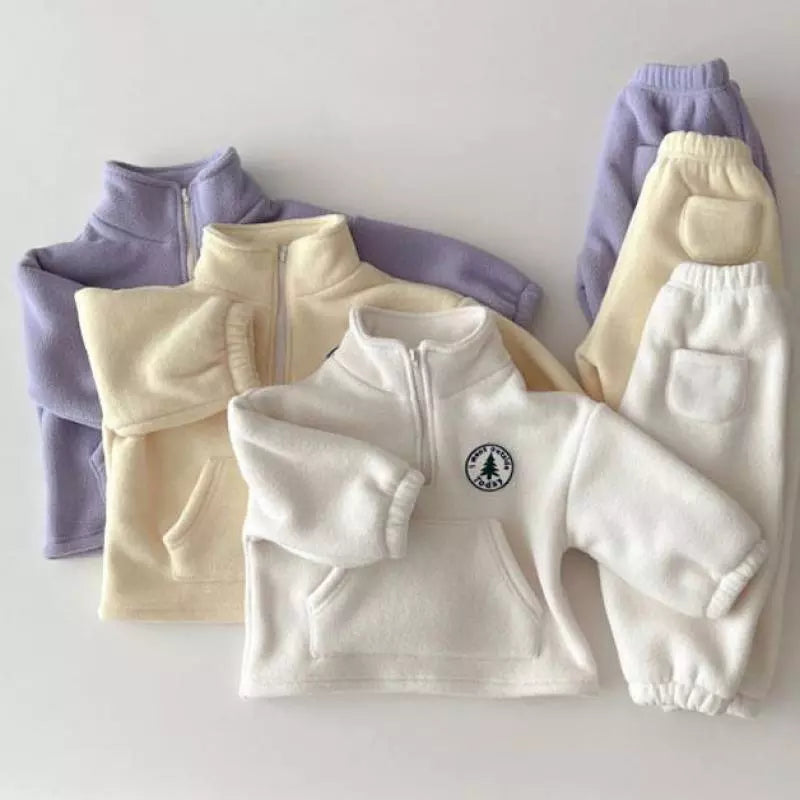 Unisex toddler outfit for winter: warm sweater with ribbed cuffs and hem.