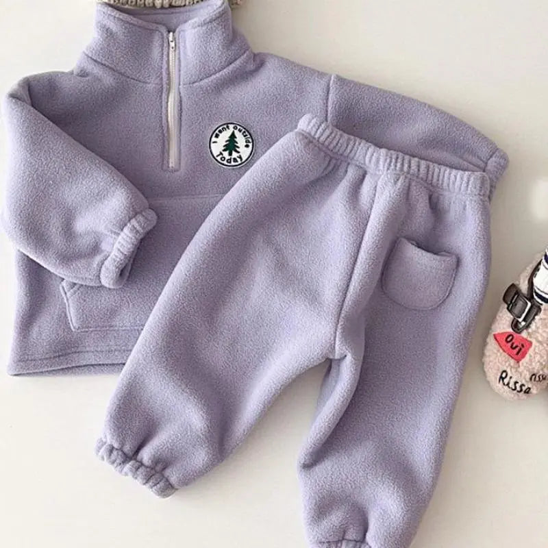 Infant dressed in a soft, breathable knit sweater and pants combo, gray, for chilly days.