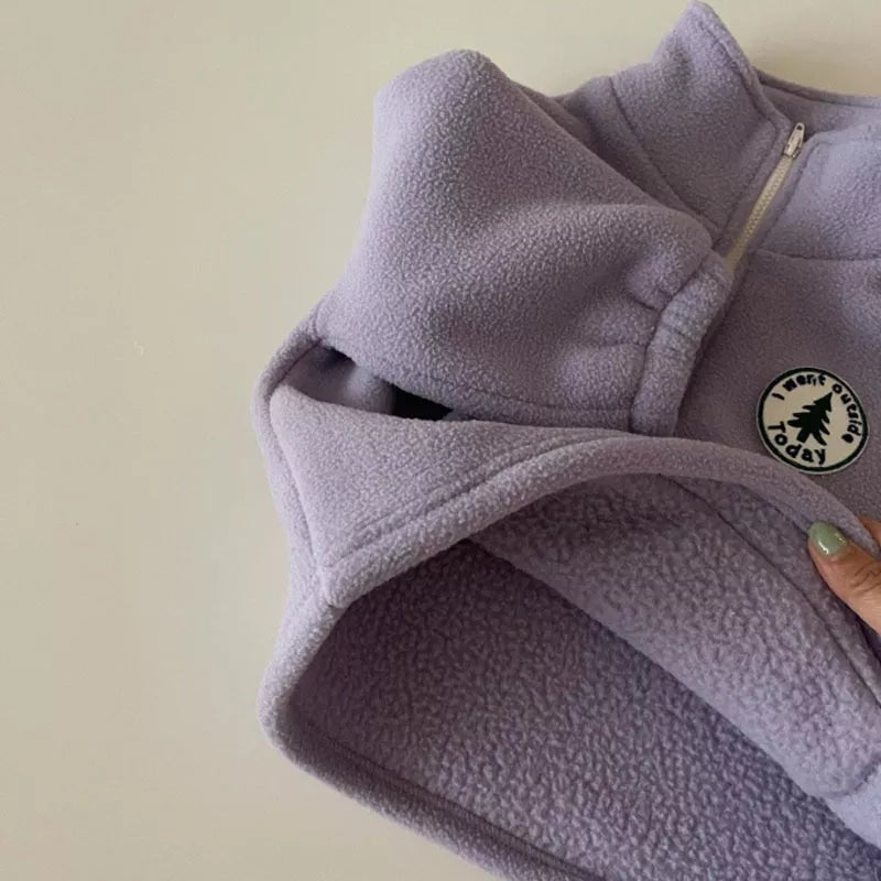 Detail of the knit texture on a unisex kids' winter warm sweater.