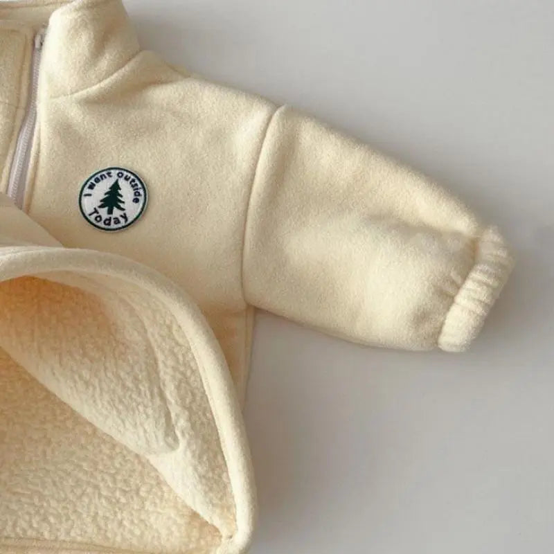 Warm knit fabric detail on the unisex baby sweater and pants winter set.