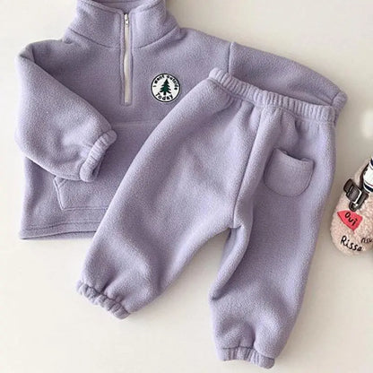 Close-up of a warm ribbed knit unisex kids sweater, perfect for winter wear.
