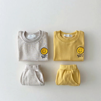 Soft cotton unisex baby hoodie set with cheerful smiley print, perfect for spring autumn