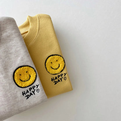 Smiling face cotton baby hoodie and trousers set, designed for unisex toddler comfort