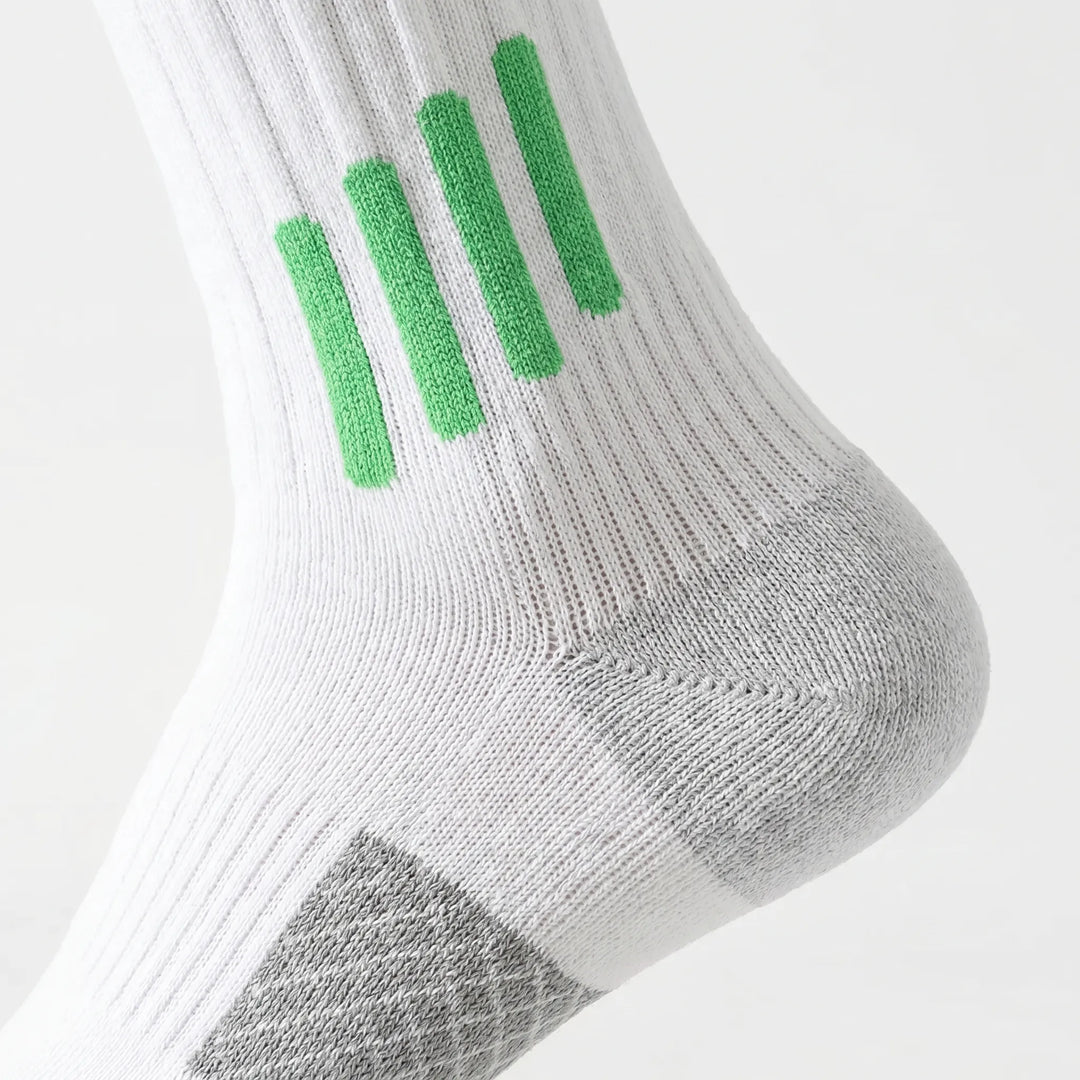 White knee-high sports socks for enhanced workout performance and training.